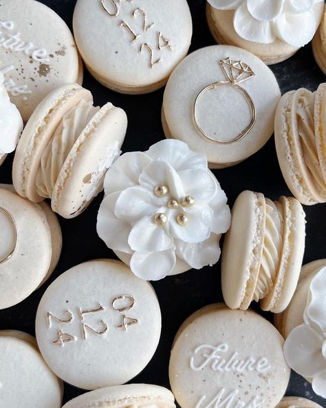 Crafted with precision and passion, these bridal macarons are a testament to turning visions into breathtaking reality 🤍 Every delicate detail – from the shimmering gold accents to the intricate royal icing flower – was meticulously brought to life. It’s moments like these that remind me why I love what I do!! 💍✨ White And Gold Wedding Shower Ideas, Bridal Macarons, Bridal Shower Macarons, White Wedding Desserts, Anniversary Macarons, Wedding Deserts Ideas, Wedding Ideas Food, Wedding Macaroons, Wedding Gold And White