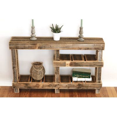 A truly unique and special Three-Tier Console Table has been built from naturally weathered reclaimed wood and comes with a halfway storage shelf for extra space. The piece shown measures 60L x 10W x 30H and will add the perfect rustic charm to your space. Please keep in mind that no two pieces will look the exact same and the natural wood color will vary in shade, texture, and tone (some grayer and some browner). This is the result of natural wood weathering. Also, please remember that old nail Barn Wood Projects, Wooden Pallet Projects, Pallet End Tables, Diy Wood Pallet Projects, Rustic Console Tables, Barn Wood Crafts, Wood Projects That Sell, Reclaimed Wood Projects, Into The Wood