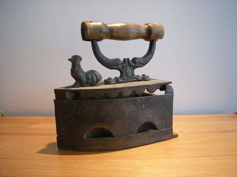 This is a heavy little object - an antique, cast iron, flat iron which uses coal of charcoal as a heat source. The lid is opened by pushing the chicken forward and hot coals are placed onto a grill inside the body of the iron Vintage Toaster, Vintage Kitchen Utensils, Vintage Laundry, Pineapple Upside, Antique Iron, Ironing Board, Antique Cast Iron, How To Iron Clothes, Vintage Iron