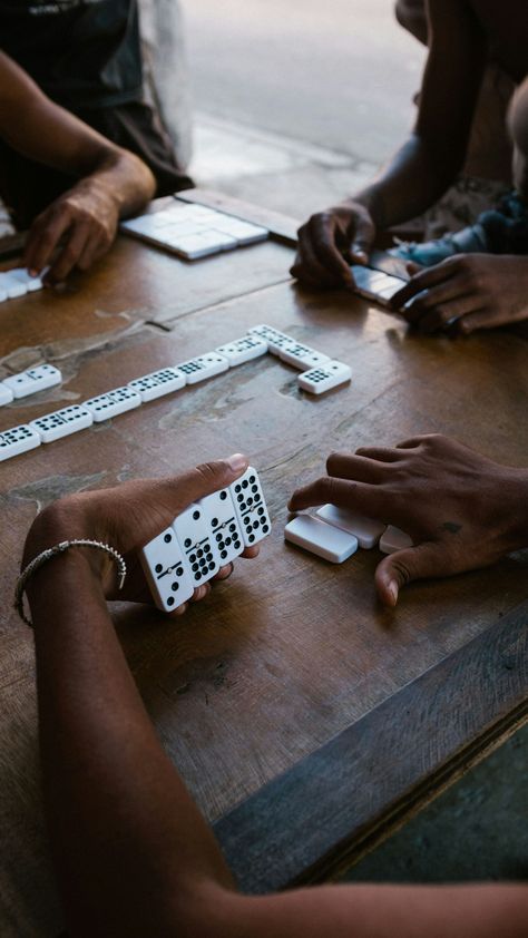 The Case For Puzzles & Other Old School Hobbies - The Good Trade Playing Dominoes, Instead Of Scrolling, Workplace Collaboration, Barbershop Ideas, How To Play Dominoes, Dominoes Game, Racing Mind, Teamwork Skills, Puzzle Table