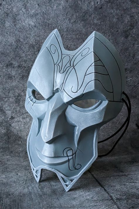 The Jhin mask from League of Legends. Just painting it gray seemed too boring to us. Therefore, we tried to make the color of the mask a little bluish-gray. And bleached all the edges for the effect of scuffing. And despite the narrow cheekbones - it sits very comfortably on the face. #leagueoflegends #jhin #jhinmask #jhinlol #riotgames #lolgame Dnd Hat, Jhin Mask, Bluish Gray, Riot Games, The Mask, League Of Legends, Party Planning, The Face, Bleach