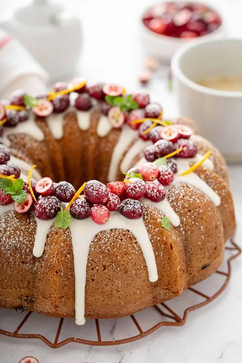 Cranberry Orange Bundt Cake is an easy and beautiful cake to feed the whole family during the holiday season. This tart and sweet bundt cake is topped with an orange glaze for the perfect finish. Chai Cake Recipe, Cranberry Orange Bundt Cake, Chai Cake, Smooth Buttercream, Orange Bundt Cake, Fresh Cranberry, Peppermint Hot Cocoa, Spice Mix Recipes, Bundt Cake Pan