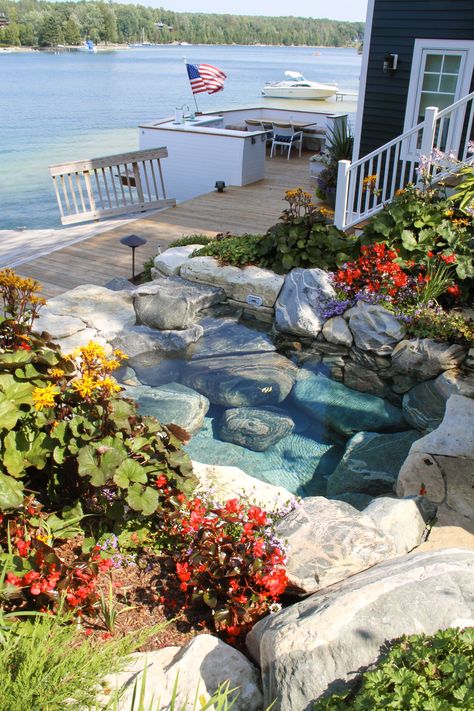 What could be better than sitting in a custom hot tub next to the lake shore? #nature#naturalstone#hottub#custom#lake#upnorth#customspa#spa Natural Rock Hot Tub, Natural Stone Hot Tub, Pool By The Lake, Pool That Looks Like A Lake, Natural Looking Hot Tub, Natural Hot Tub Backyard, Stone Hot Tub, Natural Hot Tub, Landscape Water Features