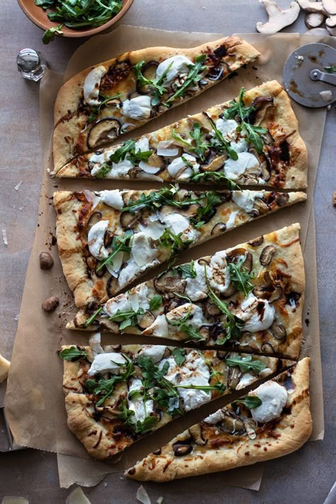 A little truffle oil, glaze and fancy greens is enough to upscale your next pizza! Truffle and Mushroom White Pizza with Arugula is a three-cheese pizza, made in 30 minutes and is sure to impress. Mushroom Goat Cheese Pizza, Mushroom Pesto Pizza, Mushroom Arugula Pizza, Truffle Pizza Mushroom, Truffle Oil Pizza Recipes, White Truffle Pizza, Fancy Pizza Toppings, Truffle Pizza Recipe, Truffle Olive Oil Recipes