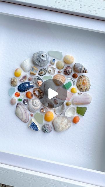 Nicola Fewings | Luxury Shell & Sea Glass Art📍Cornwall on Instagram: "Here it is!  A lovely previous customer of mine messaged to ask if I’d like to donate anything to the fundraiser she was doing for an Alzheimer’s charity. She’s running the London Marathon to raise money and I’m in awe of anyone who can do that, so I said yes 🩷  Here’s the artwork that will be sent off to its new owner soon.  #circularart #circleart #shellart #seashells🐚 #seashellcollection #shellcollection #marineplastic #cornishseaglass #blueseaglass #greenseaglass #limpets #mussels #periwinkles #cornishbeaches #seashelladdict #seashellart #oceanart #coastalartwork #coastalhomedecor #coastalinterior #artforinteriordesign #artforinterior #undertheseatheme #seatheme #lilyandsea" Shell Frame Diy, Alzheimers Art Projects, Seashell Projects Artwork, Sea Glass And Shell Art, How To Display Shells, Sea Shell Crafts Seashell Art, Seashell Aesthetic, Shell Pictures, Shells Craft