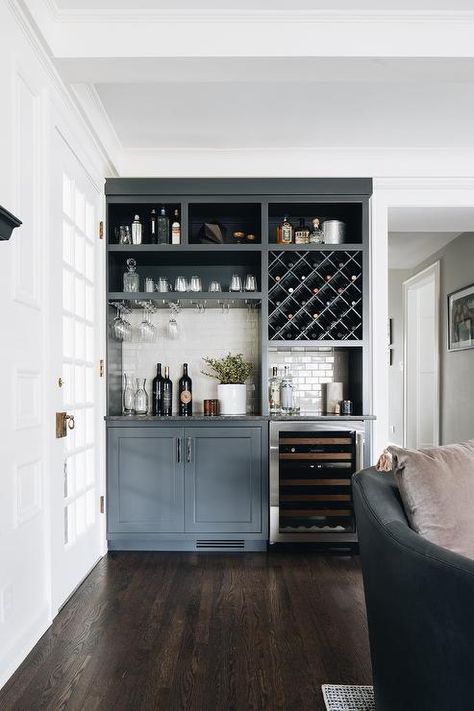 Gray living room bar features dark gray cabinets finished with a glass front wine fridge fixed beneath a black granite countertop. Built In Bar In Living Room, Bar In Living Room, Home Wet Bar, Home Bar Cabinet, Living Room Transitional, Home Bar Rooms, Modern Home Bar, Bar Sala, Home Office Inspiration