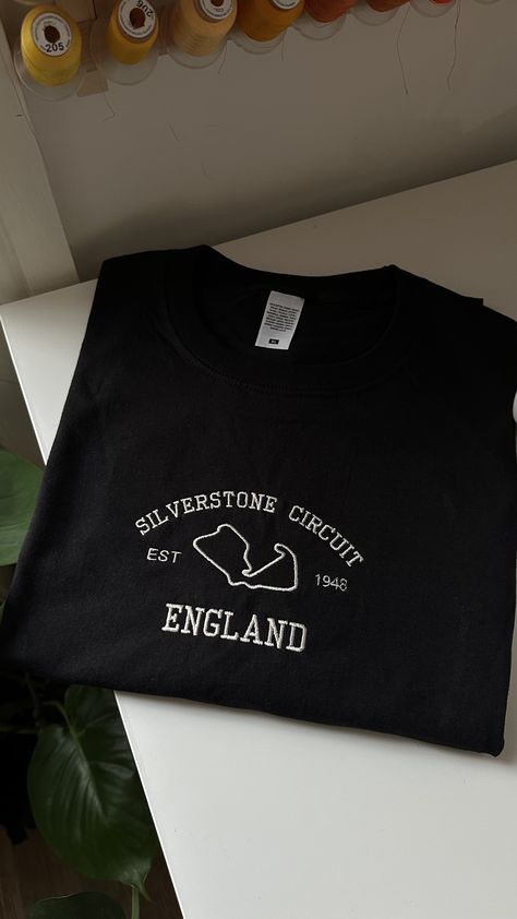 Silverstone Circuit England Embroidered T-shirt/Sweatshirt, British GP, British Grand Prix, Silverstone GP, F1, Formula 1, F1 Fan Sweatshirt Silverstone Circuit England Embroidered T-shirt/Sweatshirt, British GP, British Grand Prix, Silverstone GP, F1, Formula 1, F1 Fan Sweatshirt F1 Shirt Outfit, F1 Embroidery Designs, F1 Embroidery, Silverstone Circuit, F1 Merch, Sweatshirt Ideas, Apparel Design Inspiration, Embroidered Apparel, British Grand Prix