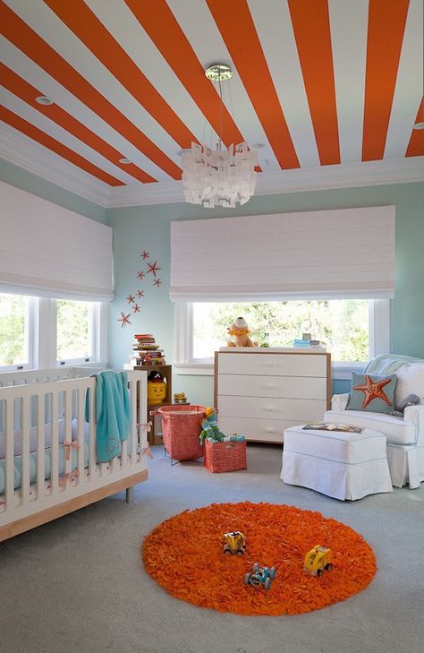 Take a cue from this kiddo’s nursery + pair soft teal walls with playful orange accessories. Orange Playroom, Orange Kids Rooms, Striped Ceiling, Boy Toddler Bedroom, Dream Nursery, Kids Room Paint, Striped Walls, Simple Room, Best Paint Colors