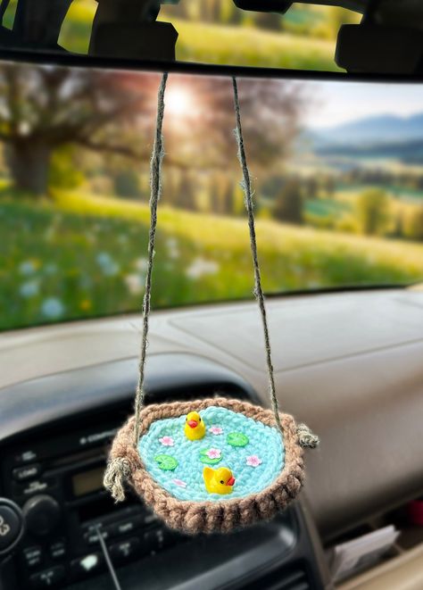 Handmade crochet ufo accessory for your car! These duckies are the best companion to add to your car ! (ducky figures not made by me) Crochet Car Mat, Crochet For Car Ideas, Crochet Car Rear View Mirror, Crochet Car Basket Free Pattern, Free Crochet Car Decor Patterns, Free Crochet Patterns Car Accessories, Crochet Car Storage, Diy Car Accessories Interior, Things To Crochet For Your Car