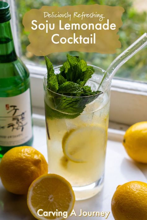 A shot of a highball cocktail glass filled with this soju lemonade cocktail. In the glass sits ice cubes, fresh lemon slices, and the cocktail. On top sits a mint garnish. A glass straw sits in the glass. Beside the glass sits lemons and a bottle of soju. Korean Lemonade, Soju Drinks Recipes, Korean Cocktails, Southern Lemonade, Soju Cocktail Recipes, Soju Cocktail Recipes Drinks, Soju Cocktails, Jinro Soju Drinks, Peach Soju Cocktail Recipes