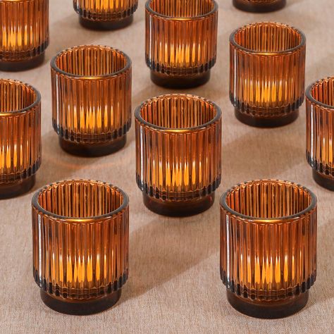 PRICES MAY VARY. Elegant Ribbed Amber Glass Votive Candle Holders - Set of 12 - Enhance your home decor with the stunning Ribbed Amber Glass Votive Candle Holders. Each holder features a sophisticated ribbed design, creating a beautiful interplay of light and shadow. Perfectly packaged in a set of 12, these vintage-inspired tea light holders are securely wrapped in bubble wrap and shipped in a sturdy brown box, ensuring they arrive in perfect condition Versatile Home Decor - Ideal for any occasi Fall Decor Boho, Tea Light Holder Wedding, Modern And Rustic Decor, Party Table Decor, Shelf Decoration, Glass Votive Candle Holders, Glass Votive Holders, Decor Shelf, Glass Tea Light Holders