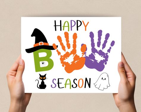 Halloween Handprint Art, Handprint craft, Happy Boo Season Printable. Perfect daycare or preschool activity. This cute design for  Halloween is a fun preschool craft. This Handprint art is designed to bring creativity to your home, daycare, or craft time. Whether you're a parent or teacher these charming handprint designs will make your creative time special and personalized.  What's Included:  High-Resolution PDF Files: File is design in high-resolution PDF format, ensuring crisp and vibrant pr Seasons Craft For Preschool, Handprint Art September, Baby Halloween Handprint Crafts, Toddler Craft Halloween, Handprint Halloween Art, Fall Arts And Crafts For Kids Toddlers, Kids Halloween Handprint Art, Daycare Halloween Crafts For Toddlers, N Handprint Craft