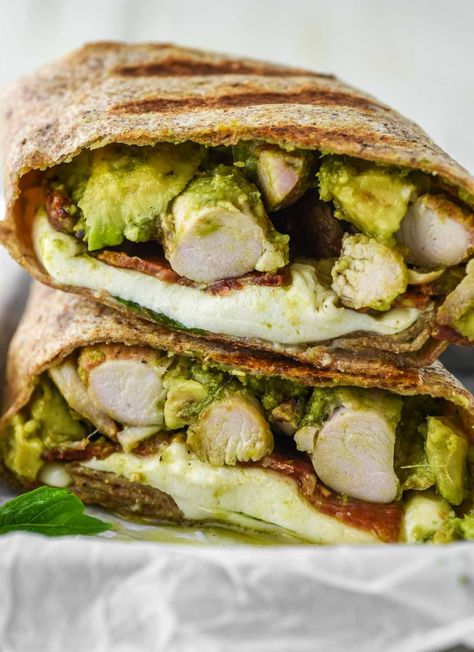 Filled with chicken, homemade pesto, avocado, bacon and cheese, this chicken pesto wrap is simple, filling, and delicious. #chickenpestowrap #chickenwrap #wrap | chiselandfork.com Pesto Chicken Wrap, Chicken Pesto Panini, Pesto Wrap, Avocado Wrap, Pistachio Pesto, Chicken Pesto, Avocado Pesto, Grilled Chicken Thighs, Bacon And Cheese