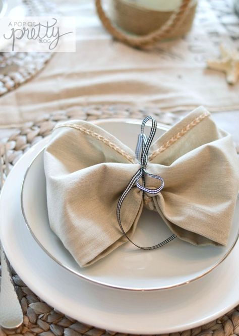 how to tie napkins into bows Tying Napkins With Ribbon, Napkin Ribbon Tie, Napkin Folding Ideas With Ribbon, Ribbon Tied Napkins, Napkins Tied With Ribbon, How To Tie Napkins Place Settings, Napkin Tied With Ribbon, Napkins With Ribbon, Napkin With Ribbon