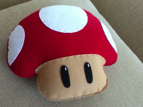 Mario B. mushroom pillow in felt. Mario Sewing Pattern, Felt Pillows Diy, Mushroom Pillow Diy, Nintendo Crafts, Mario Crafts, Mushroom Pillow, Sewing Soft Toys, Mario Plush, Super Mario Bros Party