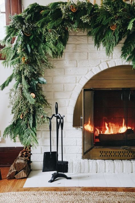 Asymmetrical garland: an unexpected take on traditional Holiday fireplace mantel decor. Hear my thought process and how to create the look at your house. Asymmetrical Garland On Mantle, Asymmetrical Garland Mantle, Diy Fresh Garland, Christmas Mantel Decorations Diy, Asymmetrical Garland, Diy Christmas Mantel, Diy Christmas Fireplace, Christmas Fireplace Mantels, Holiday Fireplace