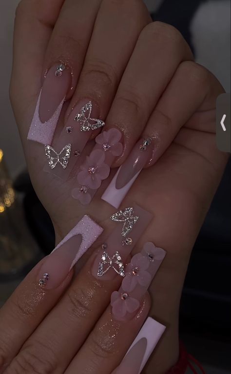 Pink French Tip Nails With Butterflies, Nail Ideas 3d Flowers Pink, 3d Flower And Butterfly Nails, Nail Inspo With Butterflies, Quinceanera Nails Butterfly, Pink French Tip Nails With 3d Flower, Acrylic Nail Butterfly Designs, Pink Quince Nails With Butterflies, Pink Rose Gold Quince Nails