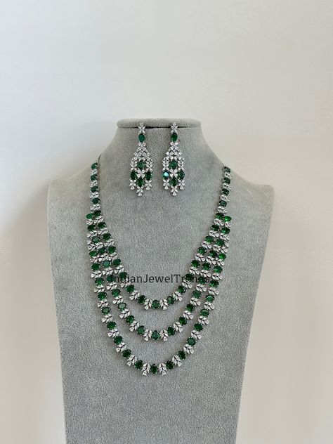 Emerald Green Silver CZ Diamond Long necklace, American Diamond Necklace,Indian pakistani jewelry for wedding, gift for her, bridal jewelry Regular size and adjustable Necklace Length 18 inches and adjustable with silver chain  Earrings length 2.75 inches Arrives in a gift box. Please let me know if you have any questions. Thank you so much for visiting my shop. Color, shades, and texture displayed may slightly vary from the actual product due to digital image limitations. We request you to consider these minor variations. Please expect the possibility of some slight imperfections when buying handmade jewelry. If you have any questions, please contact us. Diamond Long Necklace, Diamond Necklace Indian, Jewelry For Wedding, Silver Chain Earrings, American Diamond Necklaces, Big Necklace, Necklace Indian, San Ramon, Diamond Necklace Set