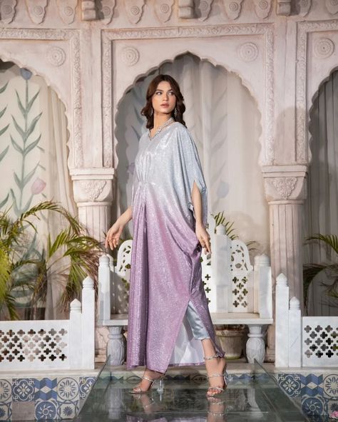 The MOONLIGHT - 2 Piece Kaftan is a must-have for any formal occasion. With its blingy design and sequence fabric, this kaftan is perfect for adding a touch of glamour to your evening look. Plus, it's perfect for night photography, making it a versatile and stylish choice. Fabric: Moonlight Includes: Kaftan and trousers  Length: 52"-53" Model's height: 5'8 ***PLACE YOUR PRE-ORDERS BY 29TH MARCH 2024 FOR GUARANTEED DELIVERY BY EID*** #readytowear #Pakistaniwedding #Pakistanibride #Moder... Moonlight Dress Design Pakistani, Kaftan Party Wear, Maxi Designs Pakistani, New Kaftan Designs, Pakistani Bridesmaid Dresses, Kaftan Dress Modern, Latest Kaftan Designs, Eid Suits, Pakistani Bridesmaids