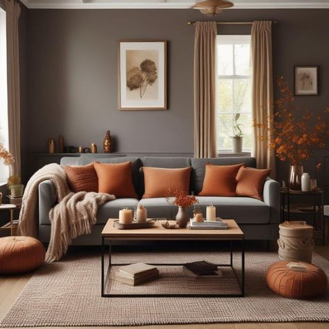 Autumn vibes alert! 🍁✨ Want to create a warm and inviting living room this season? Interior design experts spill the beans on how to infuse your space with autumnal cosiness and character. Here are some tips to turn your living room into a snug sanctuary: 1. Add blankets and throws for a touch of softness and warmth 🛋️ 2. Incorporate scents like cinnamon and eucalyptus to set the mood 🕯️ 3. Dress your fireplace with rustic garlands of dried leaves and pine cones 🔥 4. Layer your lighti... Blue Gray And Rust Living Room, Cinnamon Slate Living Room, Cosy Living Room Colour Schemes, Rust Colour Living Room, Gray And Rust Living Room, Burnt Orange And Grey Living Room, Grey And Terracotta Living Room, Grey And Rust Living Room Decor, Grey And Burnt Orange Living Room