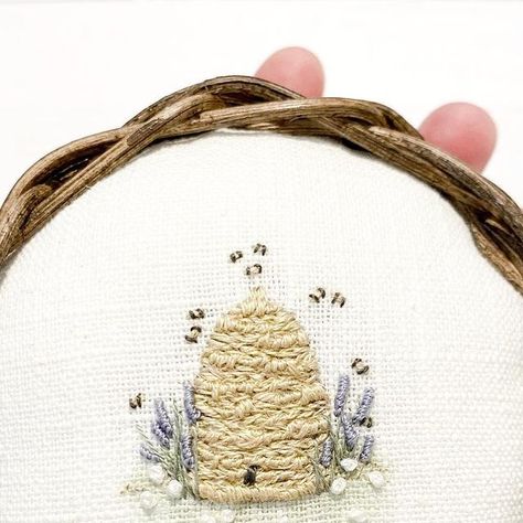 Pins & Needles Stitchery on Instagram: "Might be adding a few of these beehive pincushions to my next little sale. 🐝 . . There’s just something about these tiny little bees! 💛 . . The lovely base has been handwoven by @oldreedbaskets. It just fits so snugly in your hand! 🤎 . . #stitch #stitchery #embroider #embroidery #embroideryart #embroiderylove #pincushion #pincushions #pincushionlove #handwoven #handmadewithlove" Embroidery Honey Bee, Bee Hive Embroidery, Embroidered Beehive, Bee Embroidery Pattern Free, Beehive Embroidery, Tiny Embroidery Ideas, Bees Embroidery, Bee Embroidery Design, Embroidered Bee