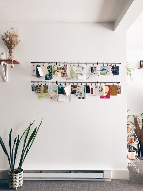 5 Ways to Display your Travel Finds at Home | The Pamplemousse Papers Unique Photo Wall Display, Unique Polaroid Display, Different Ways To Display Photos, Hanging Photo Wall, Traveler Room Decor, Polaroid Wall Display, Displaying Vintage Postcards, Ways To Display Postcards, Ways To Display Polaroids