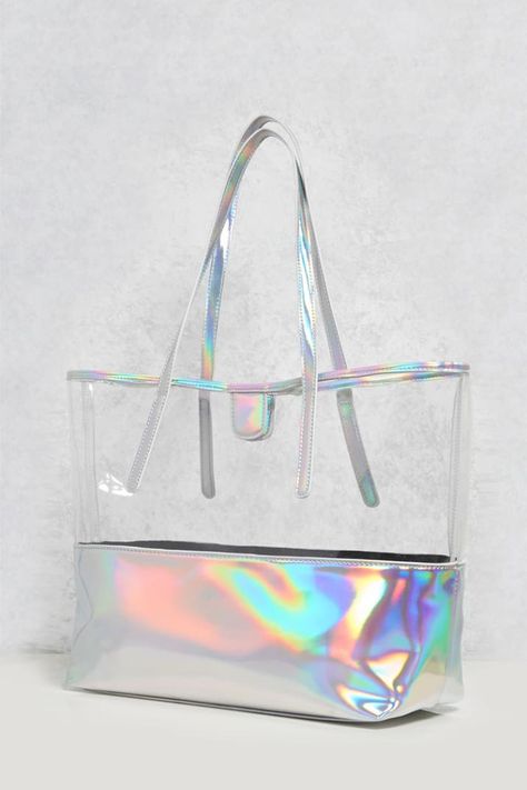 Get it from Forever 21 for $19.90.If you want a full-on holographic shopper bag, this one from Boohoo is here for ya. Ladies Bags Fashion, Holographic Fashion, Bag And Shoes, Holographic Iridescent, Holographic Bag, Unicorn Earrings, Forever 21 Bags, Clear Tote Bags, Ladies Bags