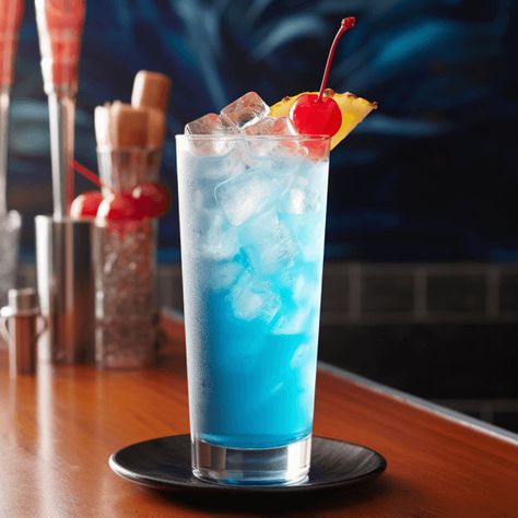 The Blue Ocean is a sweet, fruity cocktail with a refreshing tropical taste. The blue curacao gives it a citrusy edge, while the pineapple juice adds a tangy sweetness. The vodka provides a strong, smooth base that balances the sweetness of the other ingredients. Blue Lagoon Mocktail, Ocean Cocktail, Grape Ape, Raspberry Mojito, Fruity Cocktail, Malibu Rum, Fruity Cocktails, Fruity Drinks, Peach Schnapps