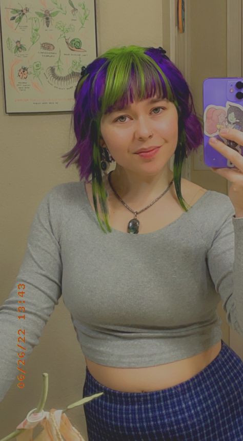 Two Tone Green Hair, Purple With Green Hair, Purple To Green Hair, Green Stripes Hair, Raccoon Tail Hair Short, Purple And Green Hair Short, Purple And Green Hair Ideas, Skunk Hair Dye Green, Purple And Green Hair Streaks