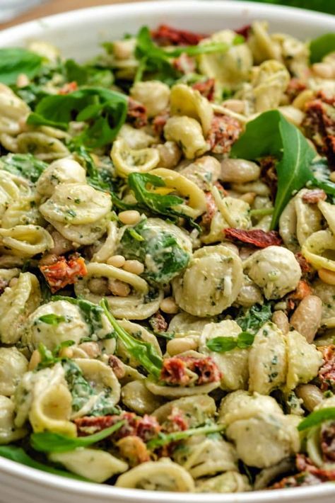 Creamy Pesto Pasta Salad - Host The Toast Creamy Pesto Pasta Salad, Creamy Pesto Dressing, Creamy Pesto Pasta, Mozzarella Balls, Pesto Dressing, Pesto Pasta Salad, Creamy Pesto, Sun Dried Tomatoes, Pesto Pasta