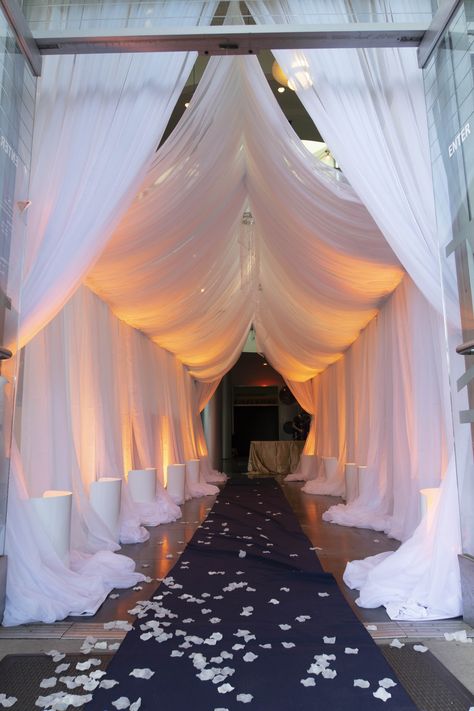 Grand Entrance for Events at Chabot Space & Science Center #Gala #Wedding #GrandEntrance #Goddess #drapes #uplight #warmsunset Party Entrance Decoration Walkways, Grand Party Decorations, Event Tunnel Entrance, Gala Night Decoration Entrance, Masquerade Entrance Decor, Main Stage Design, Party Entrance Decoration Entryway, Met Gala Prom Theme Decorations, Gala Decor Ideas