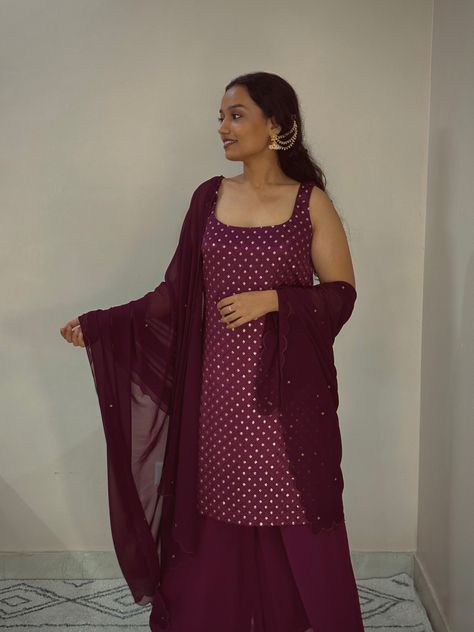 This suit set features a sleeveless short embroidered kurti with a square neckline. Paired with wide-leg palazzo pants & scalloped dupatta with zari motifs all over. Wine Suit, Scalloped Dupatta, Organza Suits, Embroidered Kurti, Wide Leg Palazzo Pants, Suit Set, Square Necklines, Fabric Details, Palazzo Pants