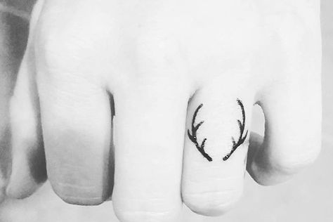 50 Of The Tiniest, Most Tasteful Tattoos Ever Tiniest Tattoos, Hanger Tattoo, Antler Tattoos, Antler Tattoo, Wedding Ring Tattoos, Wedding Rings Ideas, Finger Tattoo For Women, Deer Tattoo, Handpoke Tattoo