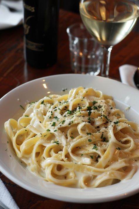 Indulge in a classic Italian favorite with this creamy and flavorful Fettuccine Alfredo recipe. This easy-to-make dish is perfect for a cozy night in or to impress guests at your next dinner party. Pair the rich and satisfying fettuccine noodles with a simple salad and crusty bread for a complete meal that everyone will love. Elevate your pasta game and treat yourself to the ultimate comfort food experience with homemade Fettuccine Alfredo tonight! Italian Food Recipes Pasta Fettuccine Alfredo, Fancy Alfredo Pasta, Best Chicken Alfredo Pasta, Fedichinni Alfredo, Pasta Esthetics, Good Eats Aesthetic, Pasta Wedding Food, Fettucini Alfredo Aesthetic, Chicken Alfredo Aesthetic