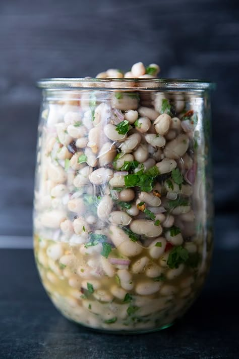 Full of fresh herb flavors, White Bean Salad comes together in a breeze. Made with canned or home cooked white beans, abundant fresh herbs, and a simple vinaigrette dressing, this salad is delicious as a light lunch on its own or as a side dish with all your favorite entrees. Dry Beans Recipe, White Bean Salad, Simple Vinaigrette, Bean Salad Recipes, One Pot Dinners, Dry Beans, Vinaigrette Dressing, Beans Recipe, White Bean