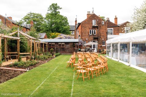 Plan a traditional English garden wedding at this Bedford property, located just thirty minutes from London. The residence's rose and clematis garden hosts up to 150 guests; the Observatory House, which was originally built in 1825, sleeps just over 20. The $1,212 base rate is subject to change, since the total tally revolves around your number of guests not staying overnight (there's an additional nine-euro charge for each non-residential attendee). Air Bnb Wedding Venues, Wedding Venue Chairs, Traditional English Garden, Airbnb Wedding Venues, Airbnb Wedding, English Garden Wedding, Garden Wedding Venue, Air Bnb, Stay Overnight