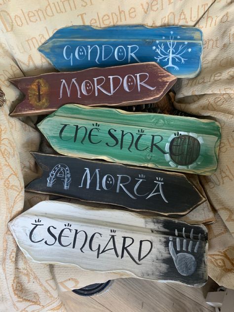 Lord Of The Rings Sign Post, The Hobbit Decorations, Trunk Or Treat Lord Of The Rings, Tolkien Wedding Decor, Lotr Decorations Party, Lord Of The Rings Themed Classroom, Lotr Diy Decor, Hobbit Halloween Decorations, Middle Earth Decor