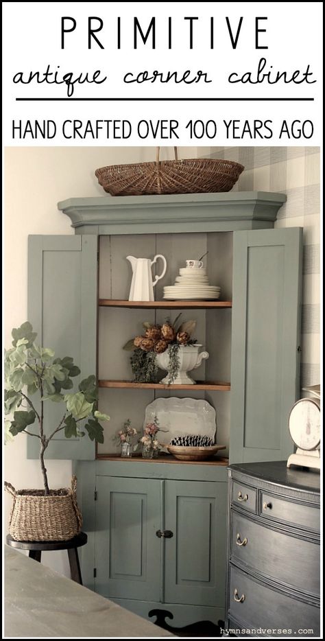 This primitive corner cabinet has been in my family for generations and is over 100 years old! I recently painted it and love how it turned out. #hymnsandverses #antiquecabinet #antiquecornercabinet #paintedcabinet #greencabinet #greenpaint #shadesofgreenpaint #paintingfurniture #furniturepainting #paintedfurniture #primitivefurniture Paint Corner Cabinet, Corner Hutch Cabinets, How To Decorate A Corner Cabinet, Corner Dining Cabinet, Corner Cabinet Repurpose, Corner Cabinet Redo Ideas, Corner Cabinet Decor Ideas, Styling A Corner Cabinet, Corner Cabinet Paint Ideas