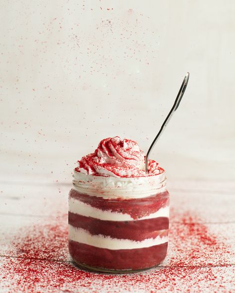 If you look beyond the striking appearance of a Red Velvet Cake, you will find that it has a very mild chocolate flavor Buttermilk gives this cake its wonderfully moist and tender crumb. Buttermilk has a thick creamy texture with a rich tangy and buttery taste in this beautiful jar topped with whipped cream. Cake In Jar Photography, Jar Cake Photography, Red Velvet Cake Photography, Red Velvet Jar Cake, White Cream Cheese Frosting, Jar Cake, Maui Food, Cake Background, Food Photography Dessert