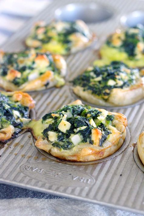 These Mini Spinach Feta pies are an easy alternative to traditional Greek Spanakopita, with only 5 ingredients and 10 minutes of hands on time! These are packed FULL of healthy spinach, and a perfect vegetarian entree or appetizer. Spinach Feta Pie, Greek Spanakopita, Picnic Finger Foods, Spinach Pies, Spinach Puff Pastry, Greek Spinach, Phyllo Recipes, Spinach Pie, Spinach Feta