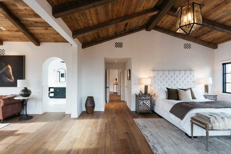 The master bedroom of a renovated 1930s Spanish-style home in Los Angeles. The renovation maintained the home's original aesthetic, with wooden floors and wood-beamed ceilings, while adding a slew of modern amenities. Spanish Style Interiors, Spanish Style Bedroom, Spanish Bedroom, Modern Spanish Style, Spanish Homes, Original Aesthetic, Hacienda Style Homes, Mediterranean Home Decor, Spanish Style Home