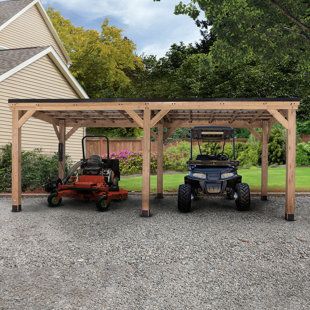 The cedar 20x12 Norwood Carport/Gazebo/Pavilion by Backyard Discovery is our largest multi-function gazebo to date. The expansive 20x12 Norwood has versatile functionality and can be used for relaxing and entertaining or as an alternative to a garage! Protect vehicles, boats, trailers, and more from the damaging elements, or enjoy an alfresco dinner under the shade of the heat-reducing roof with friends and family. The Pro-Tect Certified 20x12 Norwood is certified to withstand 12,600 pounds of s Slope Roof Design, Rectangle Gazebo, Slope Roof, Permanent Gazebo, Grill Gazebo, Steel Roof, Wooden Gazebo, Hardtop Gazebo, Backyard Gazebo