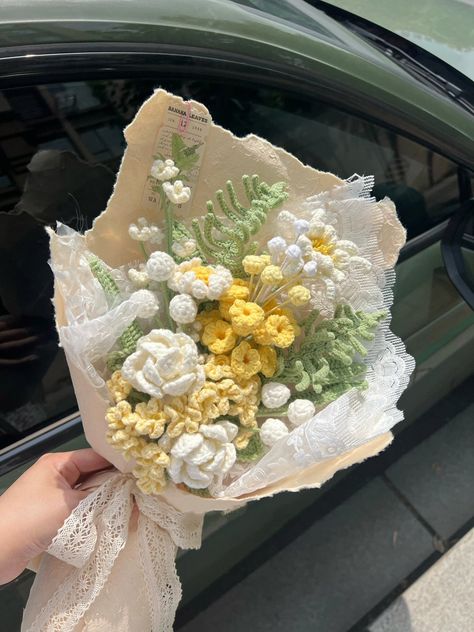 Brighten up someone's day with this vibrant bouquet featuring yellow crocheted grape hyacinths and white jasmine. The combination of cheerful colors and fragrant blooms makes it a delightful gift for birthdays, anniversaries, or simply to spread joy. The price includes the packaging on the picture. The product you receive is the same as the picture in our system. Because there may be a shortage of a certain type of packaging material, a similar style will be used instead.But not very different,