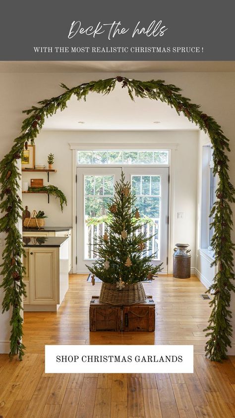 christmas arch garland decor with norway christmas tree Door Arch Garland Christmas, Garland Around Archway Christmas, Christmas Garland Hallway Arch, Christmas Decorations Archway, Christmas Decor Arch, How To Decorate Arches In House, Christmas Arch Decorations, Arch Mirror Christmas Decor, Garland In Archway Christmas