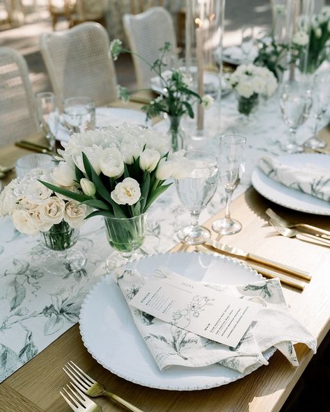 Give me some bb tulips in the most romantic glass vessels and I’m sold. Still in love with this summer stunner for A+D. Photography: @hellobluephoto Florist: @_everbloom Planning + Design: @vineandbrancheventsco Linens: @stradleydavidson Tabletop Rentals: @catalogatelier Furniture: @adorefolklore Signage: @wildhouseink Tulip Wedding Table, White Tulip Wedding, Green And White Wedding, Tulip Wedding, Wedding Place Settings, White Tulips, Still In Love, Wedding Place, Glass Vessel