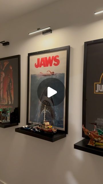 Ethan Dewhurst on Instagram: "New LEGO display is done 🙌 thoughts? Was really excited to create this display that combined two of my passions: film + LEGO. Spielberg was my favorite director growing up and his movies were an inspiration for me deciding to go into the video industry over a decade ago. #lego #legodisplay #legoroom #legoafol #legoideas #jaws #jurassicpark #indianajones" Lego Display Ideas Diy, Cool Lego Display Ideas, Lego Friends Display, Lego Build Room, Lego In Wall, Lego Brickheadz Display Ideas, Movie Display Ideas, Brickheadz Display Ideas, Lego Sets Display Ideas