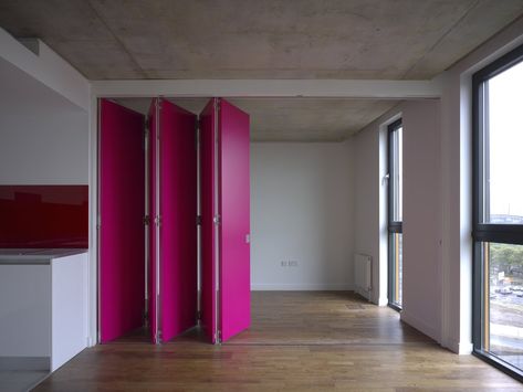 Retractable magenta wall - Trendir Ancoats Manchester, Magenta Walls, Moveable Wall, Accordion Doors, Moving Walls, Movable Walls, Sliding Wall, Micro Apartment, Interior Wall Design