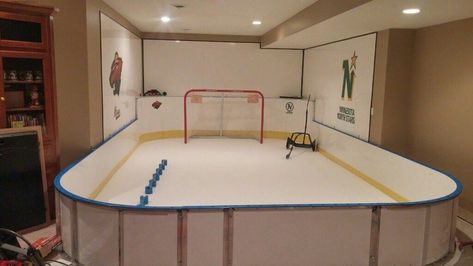 This 10' x 20' basement #syntheticice rink features D1 Glide Infused Self Lubricated #SyntheticIce and the combination of D1 Tall (42") and Short (24") #hockeyboards. D1 hockey #dasherboards are handcrafted in the U.S.A. D1 #hockeyboards will help your #outdoorrink project in so many ways. If you are considering #syntheticice and looking to build a synthetic #icerink or you need #hockeyboards for your #backyardicerink or #backyardrink, D1 #hockeyboards are the perfect #hockeyrink solution. Indoor Hockey Rink In House, Basement Hockey, Hockey Basement, Hockey Man Cave, Hockey Organization, Synthetic Ice Rink, Indoor Hockey, Backyard Ice Rink, Backyard Rink