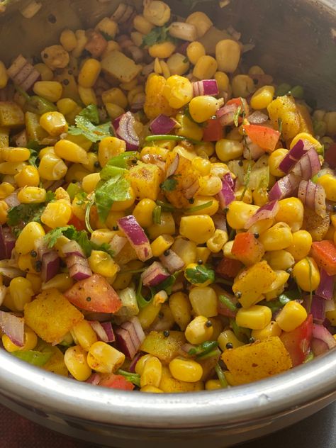 Frozen Corn & boiled potato with Rai & turmetic tadka. Mix it with onion, tomatoes, coriander,Lemon,chat masala,salt,chilli powder. Corn Potato Salad, Corn Chat, Masala Corn, Chat Masala, Boiled Potatoes, Frozen Corn, Chilli Powder, Chana Masala, Potato Salad