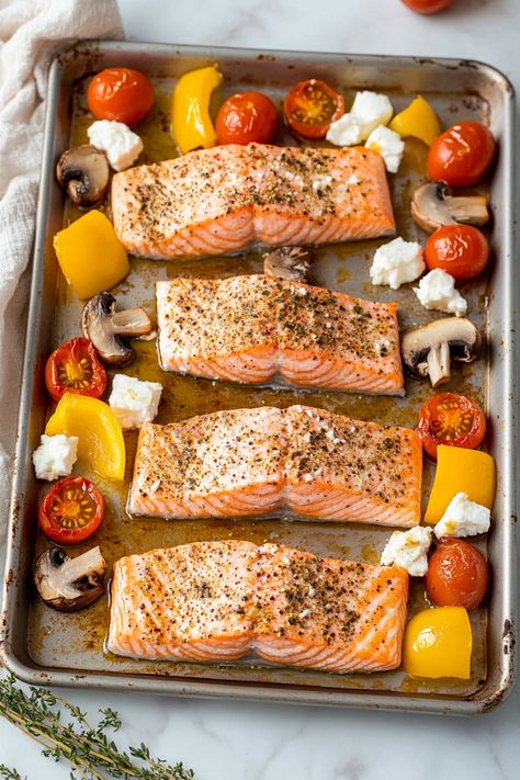 Discover a flavorful and healthy recipe for baked salmon with vegetables and feta. This dish is perfect for a delicious weeknight dinner or an impressive meal when entertaining guests. The juicy salmon pairs perfectly with the tender and colorful vegetables, all topped off with creamy feta cheese for that extra burst of flavor. Whether you are looking to eat healthier or simply enjoy a tasty meal, this baked salmon recipe will surely satisfy your cravings while providing essential nutrients. Try Salmon With Vegetables, Feta Bake, Best Salmon Recipe, Baked Salmon Recipe, Creamy Feta, Easy Salmon Recipes, Baked Salmon Recipes, Colorful Vegetables, Eat Healthier